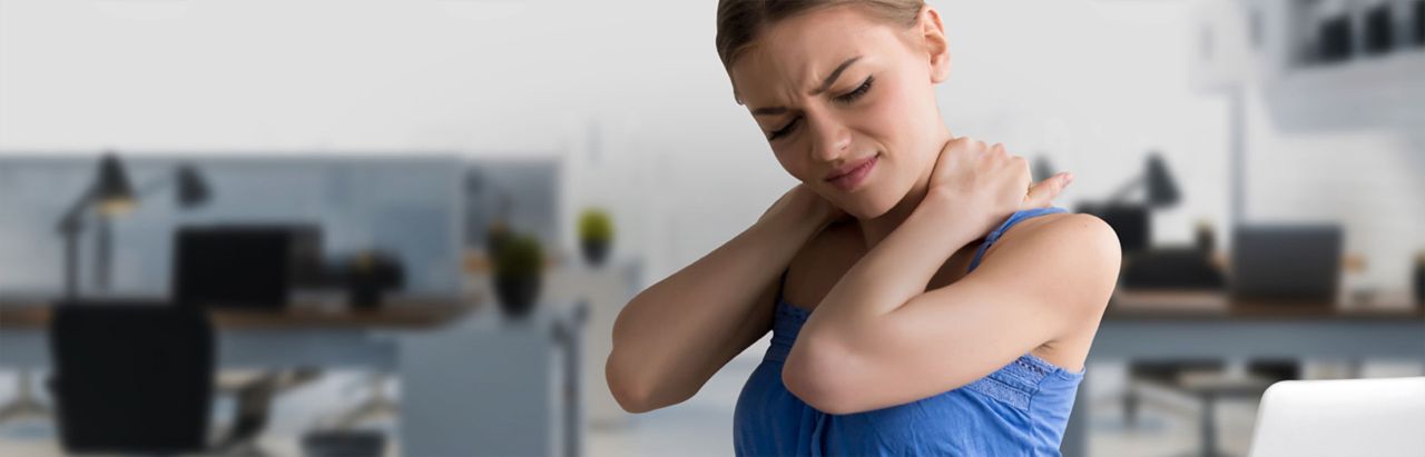 Woman rubbing sore neck